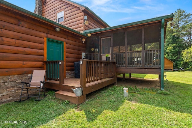 deck with a lawn and a sunroom