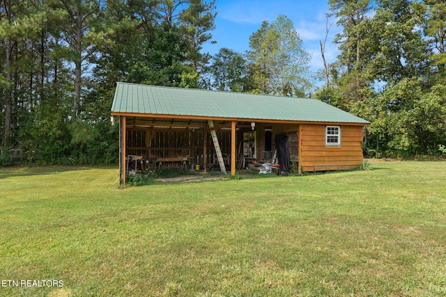 view of outdoor structure with a lawn