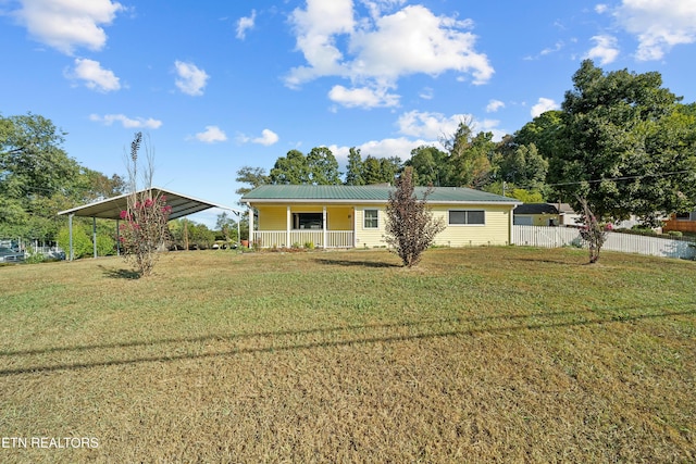 single story home with a front yard, a carport, and covered porch