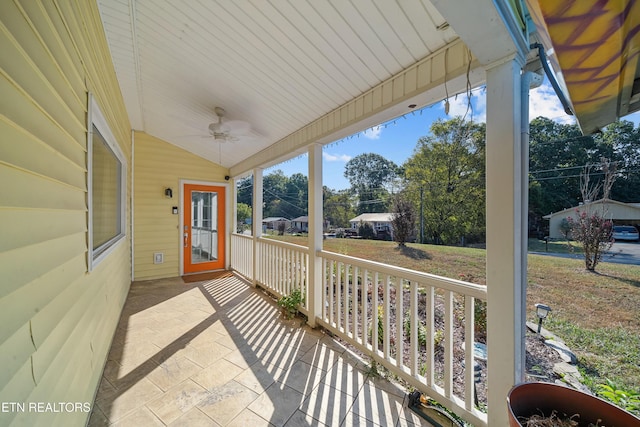 exterior space with ceiling fan