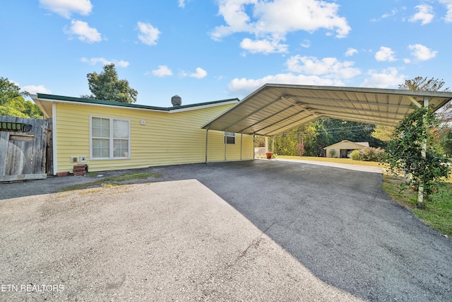 view of front of home featuring a carport