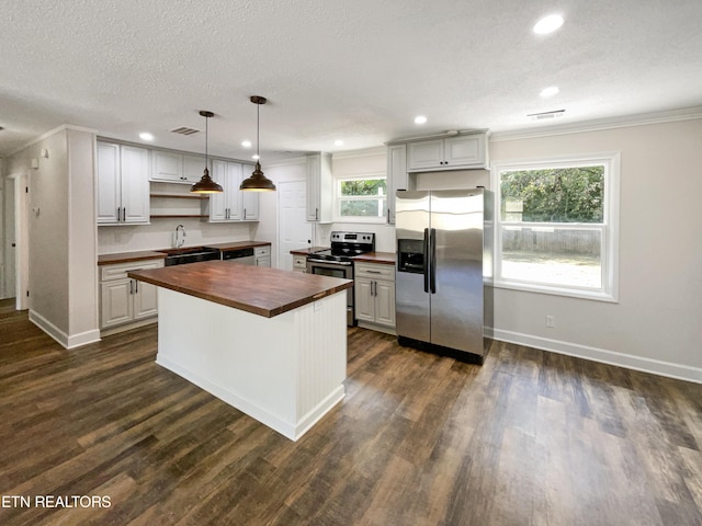 kitchen with wooden counters, a center island, dark wood-type flooring, stainless steel appliances, and open shelves