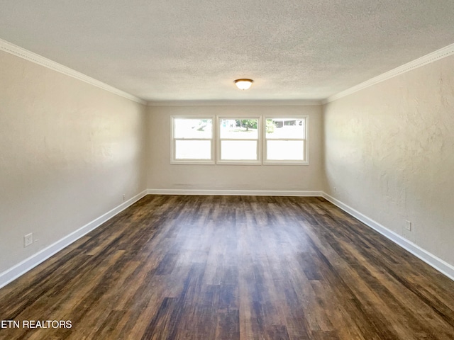 spare room featuring a textured ceiling, crown molding, and dark hardwood / wood-style floors