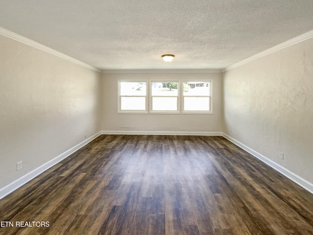 unfurnished room with dark wood finished floors, a textured ceiling, crown molding, and baseboards