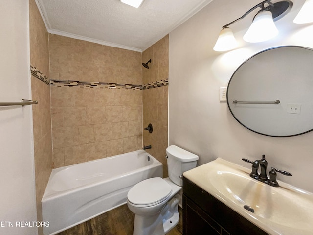 bathroom featuring vanity, wood finished floors, bathtub / shower combination, a textured ceiling, and toilet