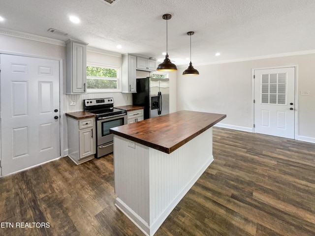 kitchen with crown molding, dark wood-style floors, appliances with stainless steel finishes, and butcher block countertops