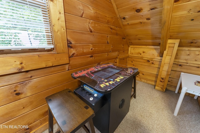 interior space featuring wood walls and light colored carpet