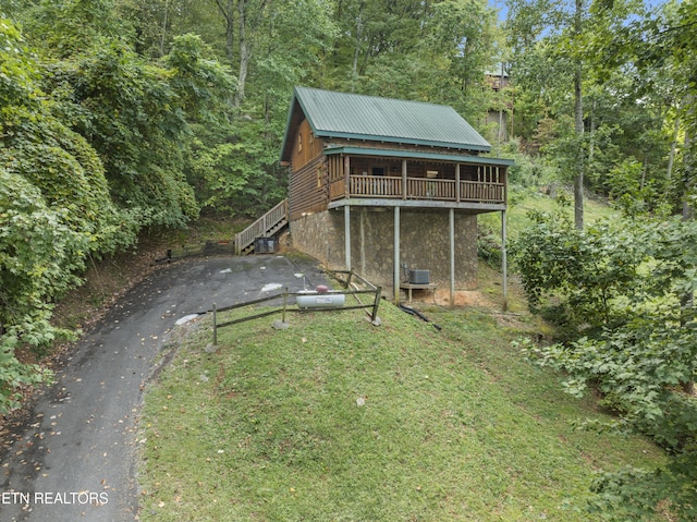 view of yard featuring cooling unit and a wooden deck