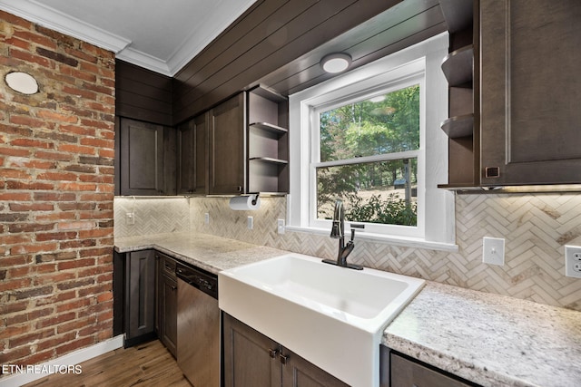 kitchen featuring light stone counters, light hardwood / wood-style floors, sink, dark brown cabinetry, and stainless steel dishwasher