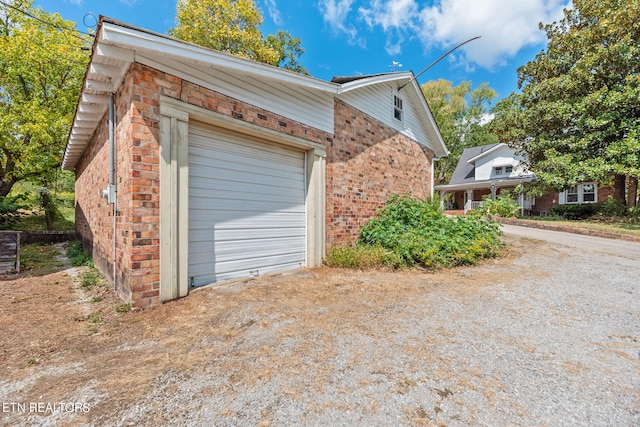 view of property exterior with a garage