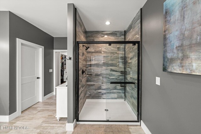 bathroom with a shower with shower door