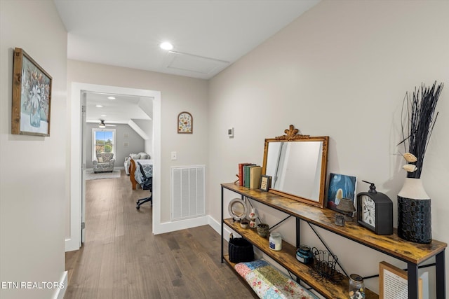 hallway with dark wood-type flooring