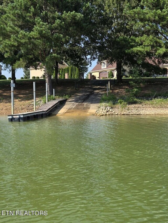 property view of water with a dock