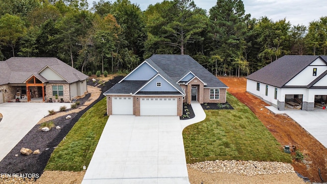 view of front of home featuring a front lawn and a garage