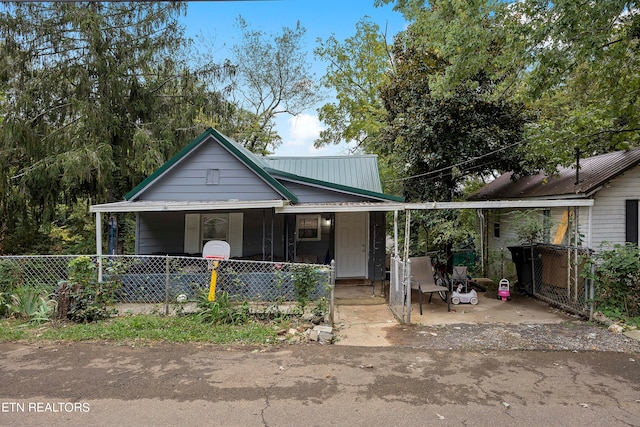 view of front of property with a carport