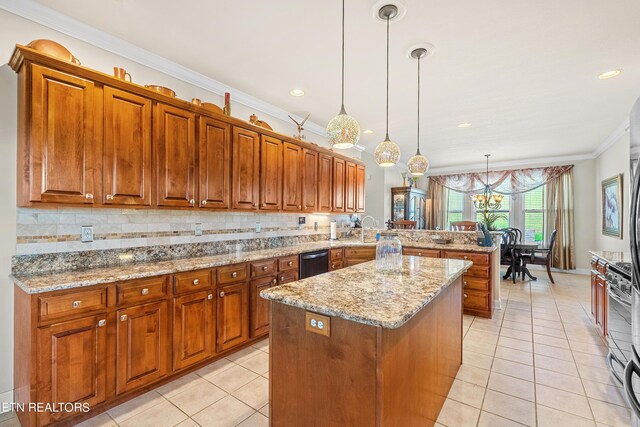 kitchen featuring a kitchen island, pendant lighting, a notable chandelier, kitchen peninsula, and ornamental molding