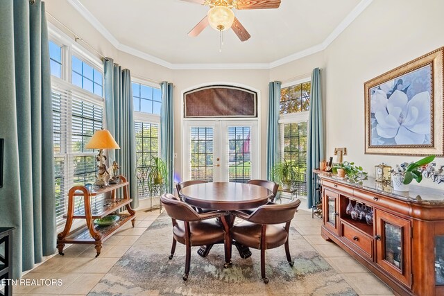 dining room with ceiling fan, ornamental molding, light tile patterned floors, and french doors