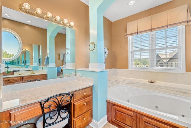 bathroom featuring vanity and a bathtub