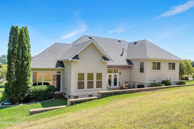 155 Killdeer Dr, Vonore, TN 37885 - back of house featuring a shingled roof, a lawn, stucco siding, and a patio area