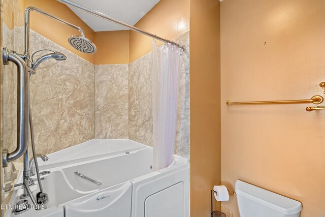 bathroom featuring toilet and shower / tub combo with curtain