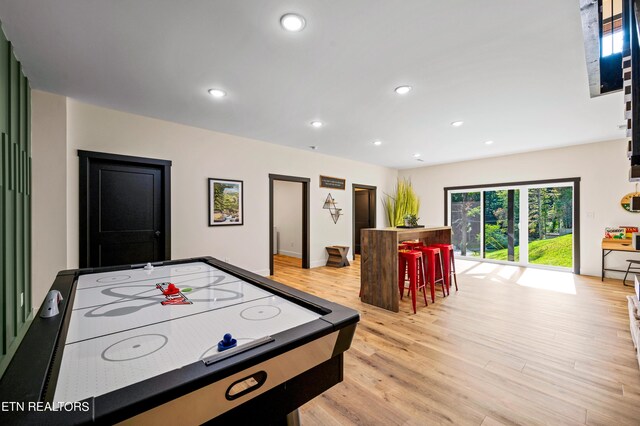 recreation room featuring light wood-type flooring