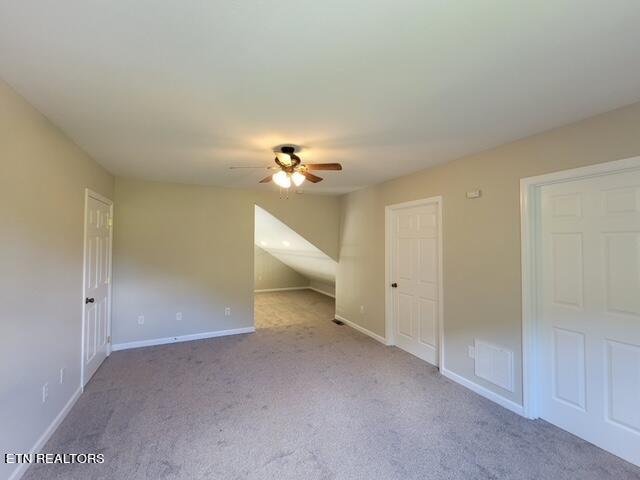 unfurnished bedroom featuring ceiling fan and light colored carpet