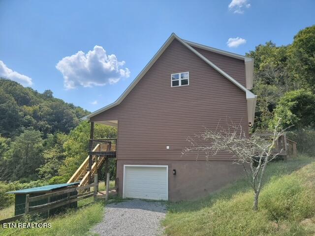 view of side of property with a garage