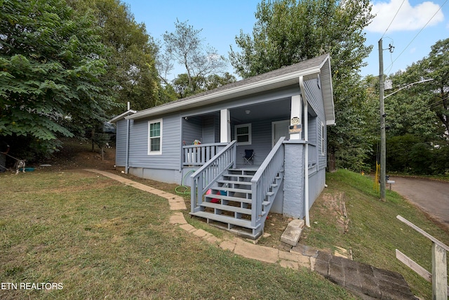 view of front of home featuring a porch and a front lawn