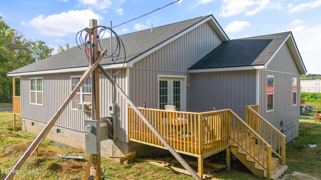 rear view of house featuring a deck