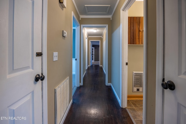 hall featuring ornamental molding, dark hardwood / wood-style floors, and heating unit