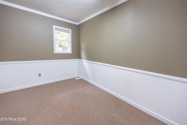 carpeted spare room with ornamental molding