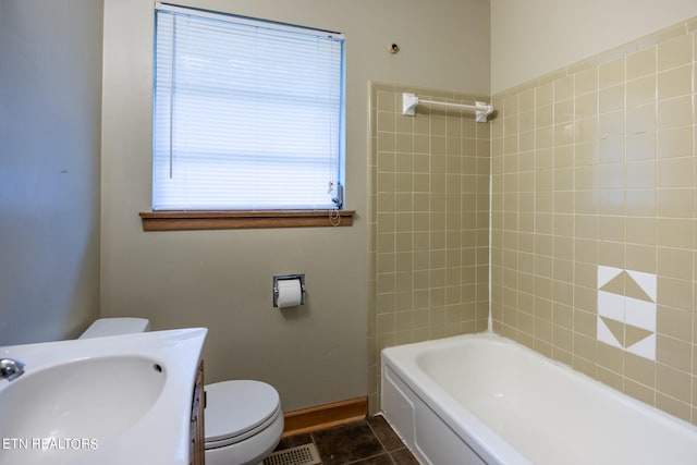 full bathroom featuring shower / bath combination, toilet, vanity, and tile patterned floors