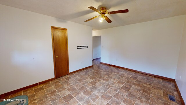 unfurnished room with ceiling fan