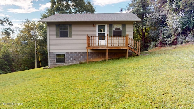 exterior space featuring a lawn and a wooden deck