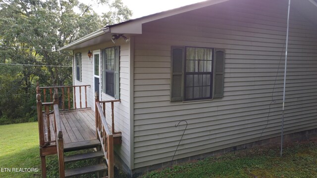 view of property exterior featuring a deck