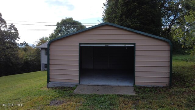 view of outdoor structure with a lawn