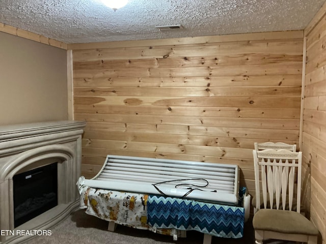 view of sauna / steam room with carpet floors and wood walls