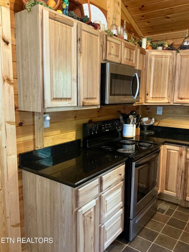 kitchen with light brown cabinetry, appliances with stainless steel finishes, and wooden ceiling