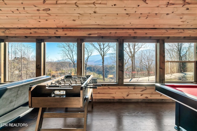 dining area featuring billiards, plenty of natural light, dark hardwood / wood-style floors, and a mountain view