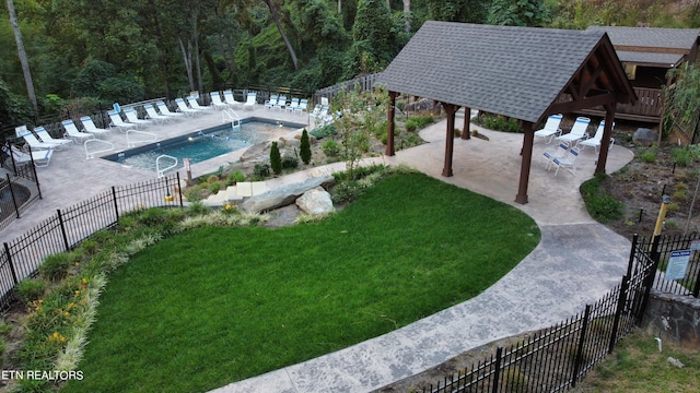 view of yard with a gazebo, a community pool, and a patio