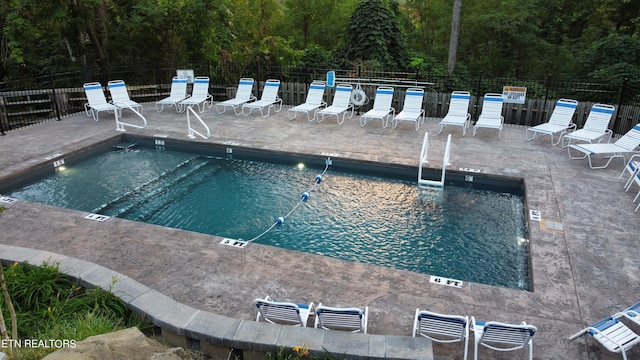 view of swimming pool featuring a patio