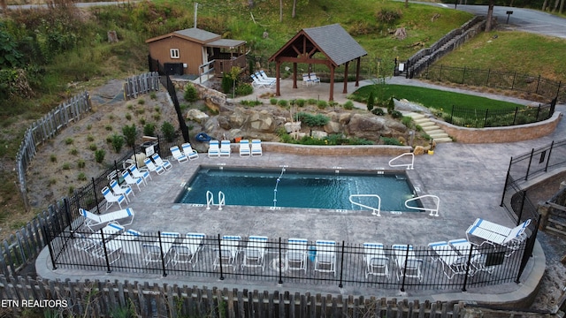 view of pool featuring a gazebo and a patio