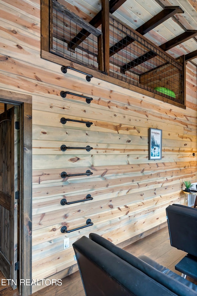 interior space with wooden ceiling, wooden walls, and hardwood / wood-style flooring