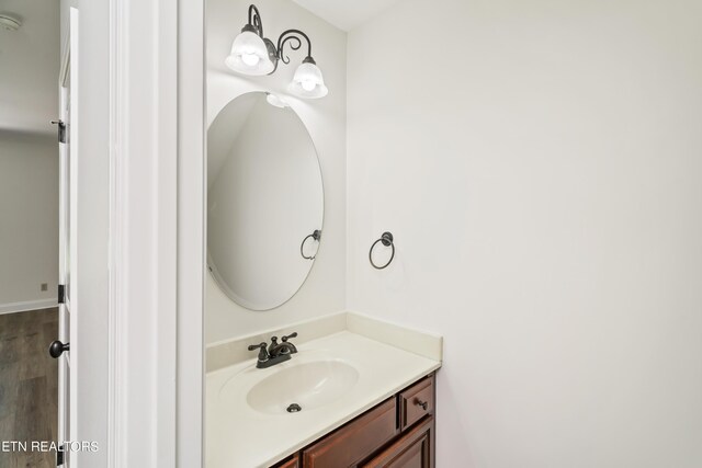 bathroom featuring vanity and wood-type flooring