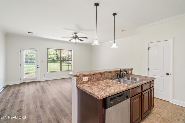 kitchen featuring decorative light fixtures, sink, an island with sink, ceiling fan, and stainless steel dishwasher