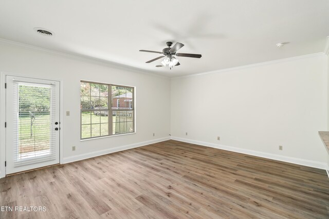 unfurnished room with light wood-type flooring, ornamental molding, and ceiling fan