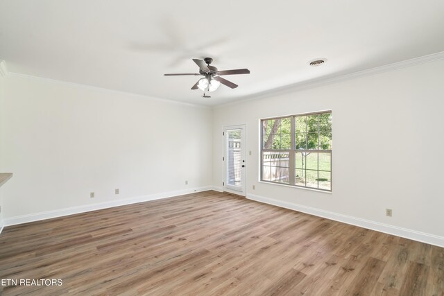 unfurnished room with crown molding, wood-type flooring, and ceiling fan