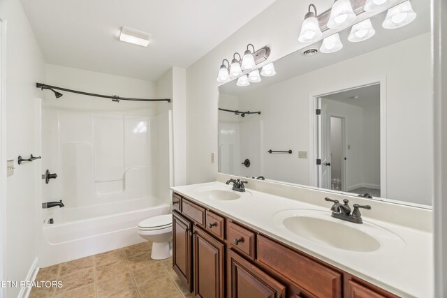 full bathroom featuring tile patterned floors, shower / bath combination, toilet, and vanity