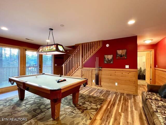 recreation room with hardwood / wood-style flooring and pool table