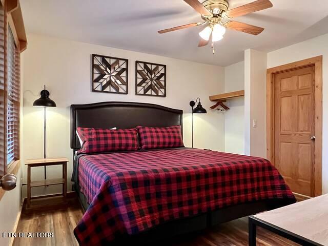 bedroom with ceiling fan and hardwood / wood-style floors